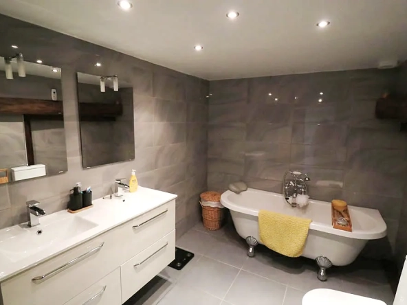 Modern bathroom with freestanding bath and double vanity