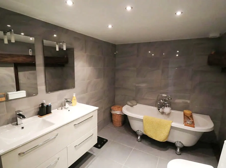 Modern bathroom with freestanding bath and double vanity
