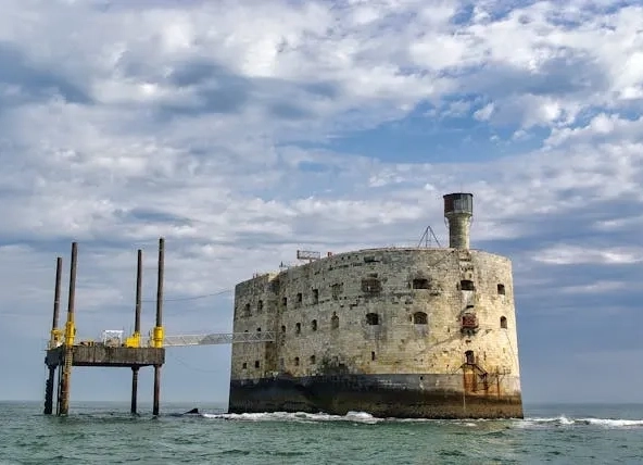 Fort Boyard against a cloudy sky over ocean