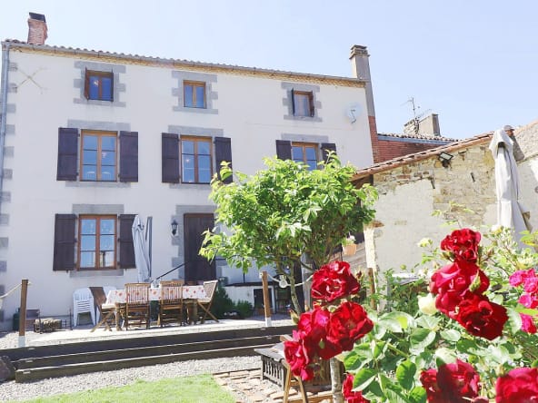 Country house with garden and flowers.